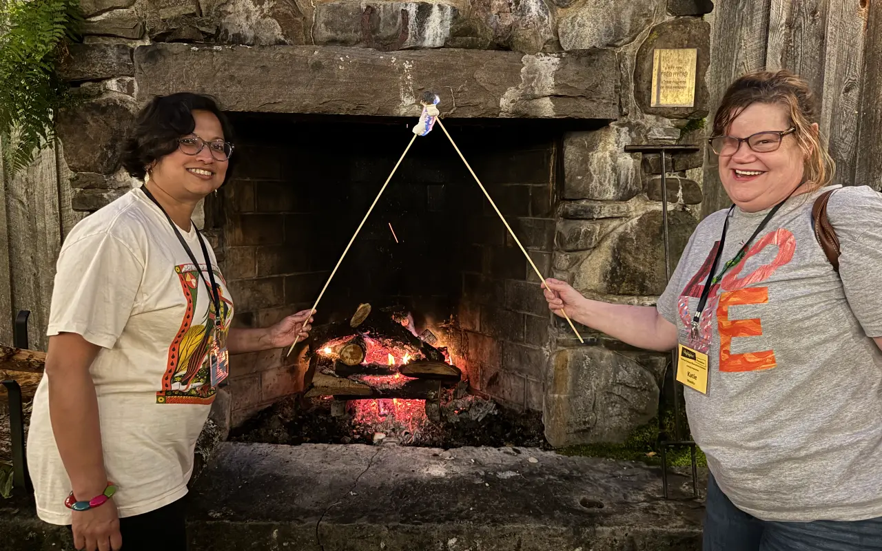 Photo of Summer Camp attendees making smores