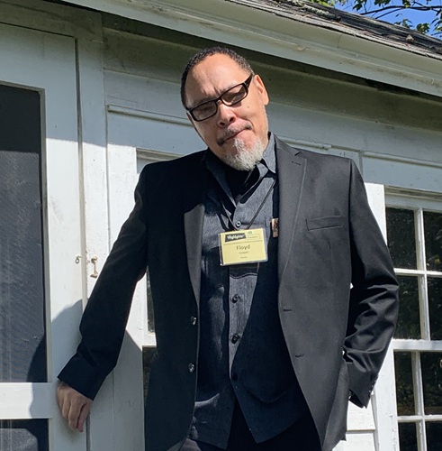Photo of Floyd Cooper in front of the Art Coop at the Boyds Mills Retreat Center