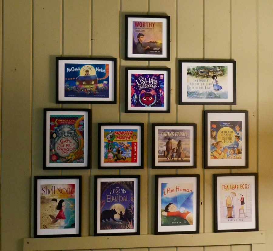 Book covers on the wall in Cabin 8